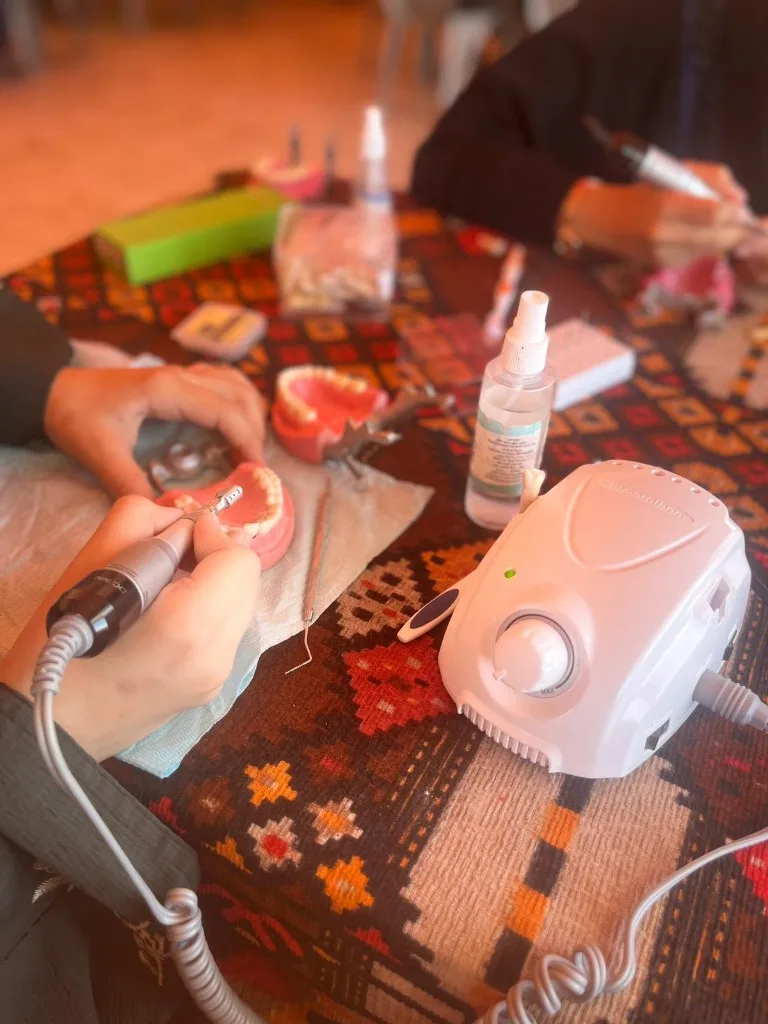 Dental students practising clinical procedures on dental training models