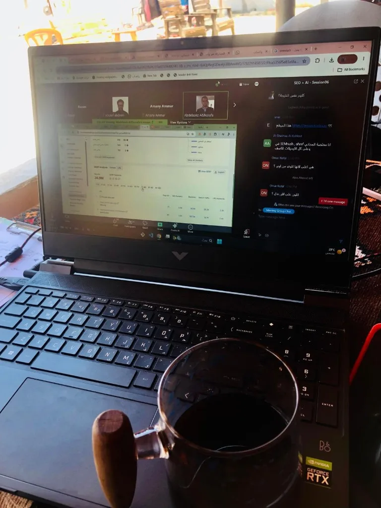 A laptop screen showing an online meeting with several participants